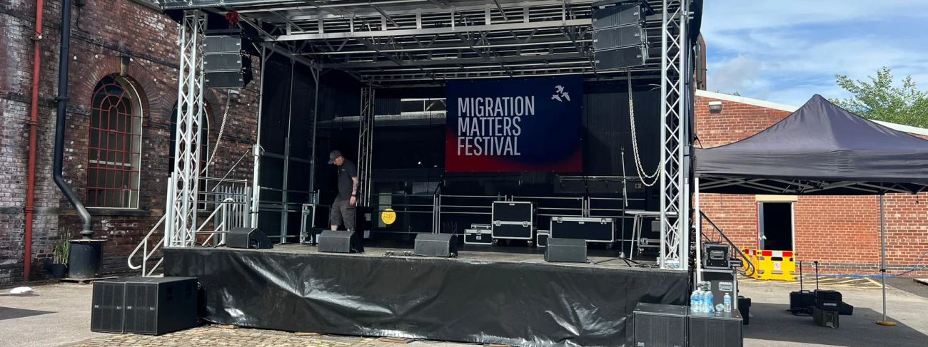 Flown line-array PA on a 7x6m outdoor stage